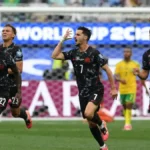 Canadá vence África do Sul nos acréscimos e avança às oitavas
