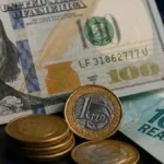 Dólar cai a R$ 5,10 e juros recuam para 14%